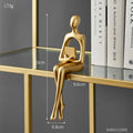 Figura Decorativa Dorada – Escultura Minimalista para Repisa